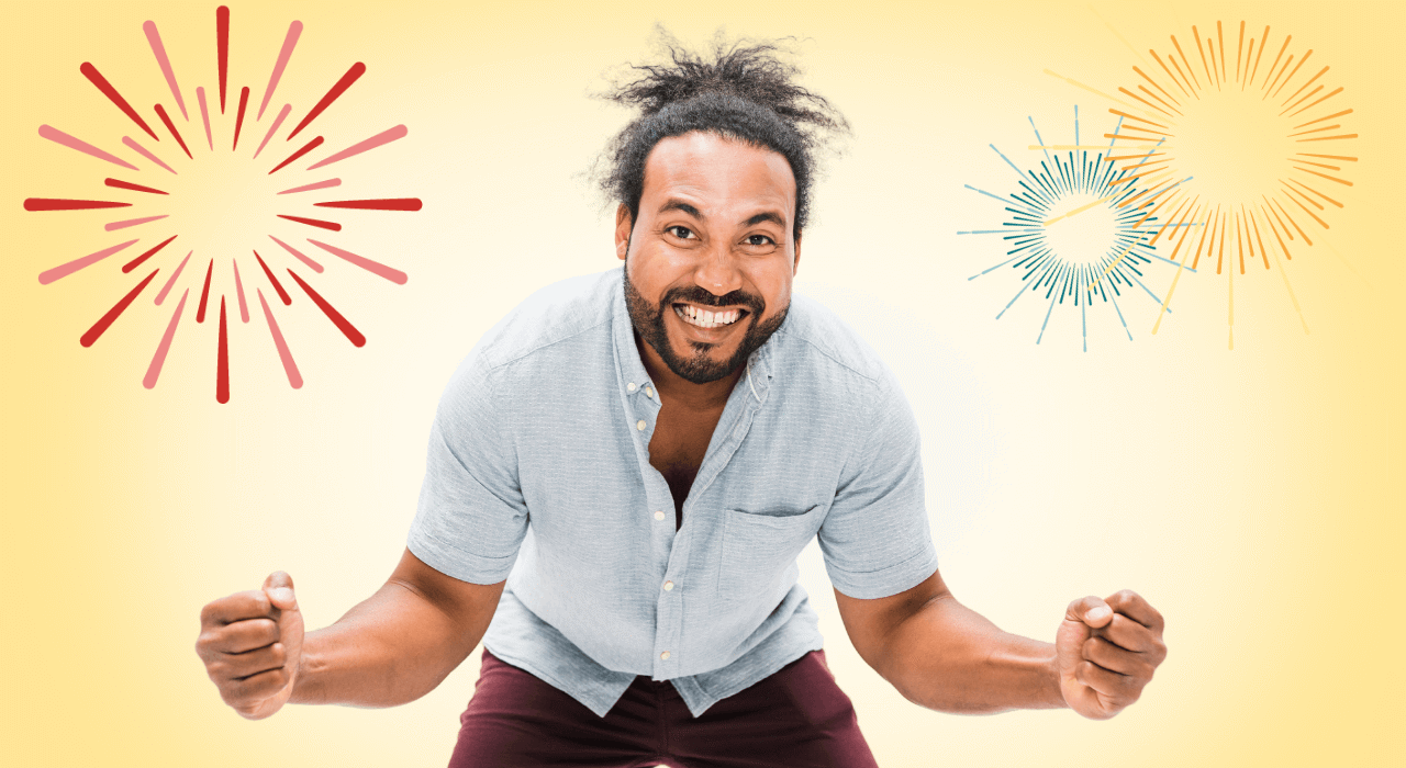 Leende man i segergest mot gul bakgrund med fyrverkerigrafik.